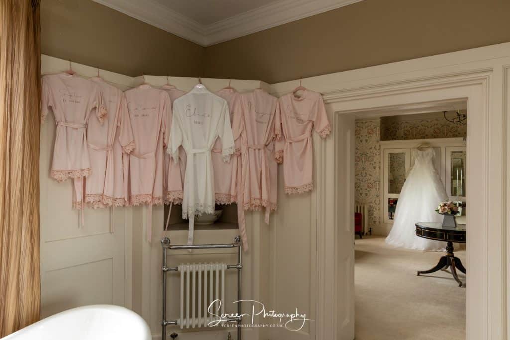 hodsock priory wedding photography bride dress and bridesmaids dresses in master honeymoon suite